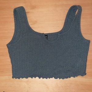 Green tank top. A little short  but in good condition. only worn once.